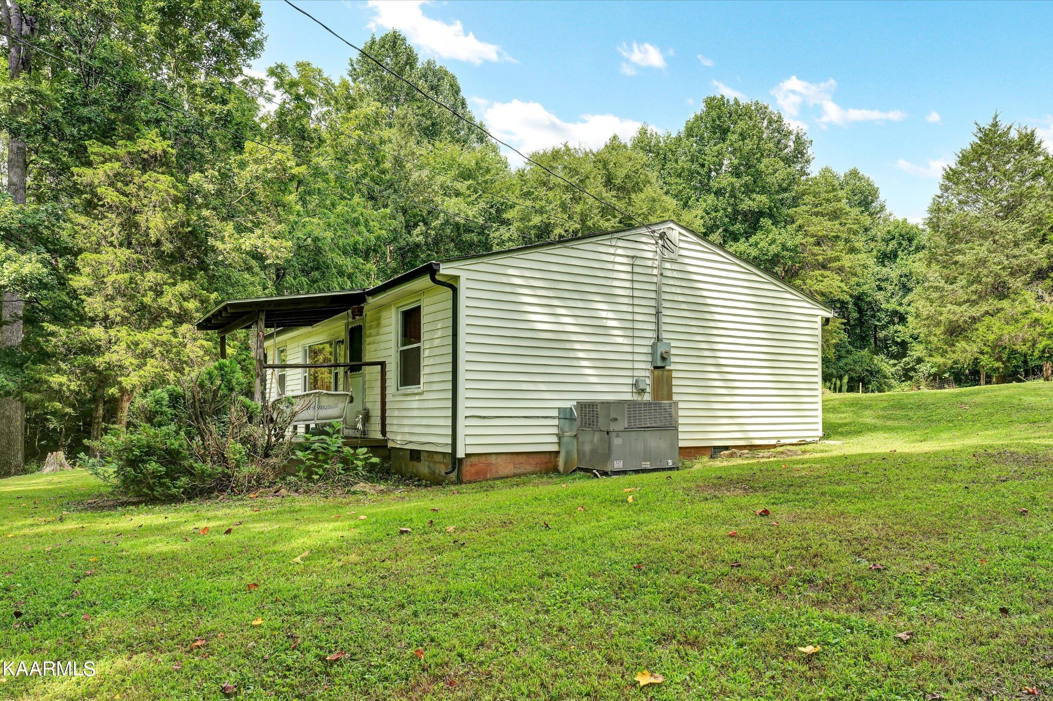 185 Moody Hollow Road Powell, TN 37849 - Photo 2 of 46 a view of a house with yard and garden