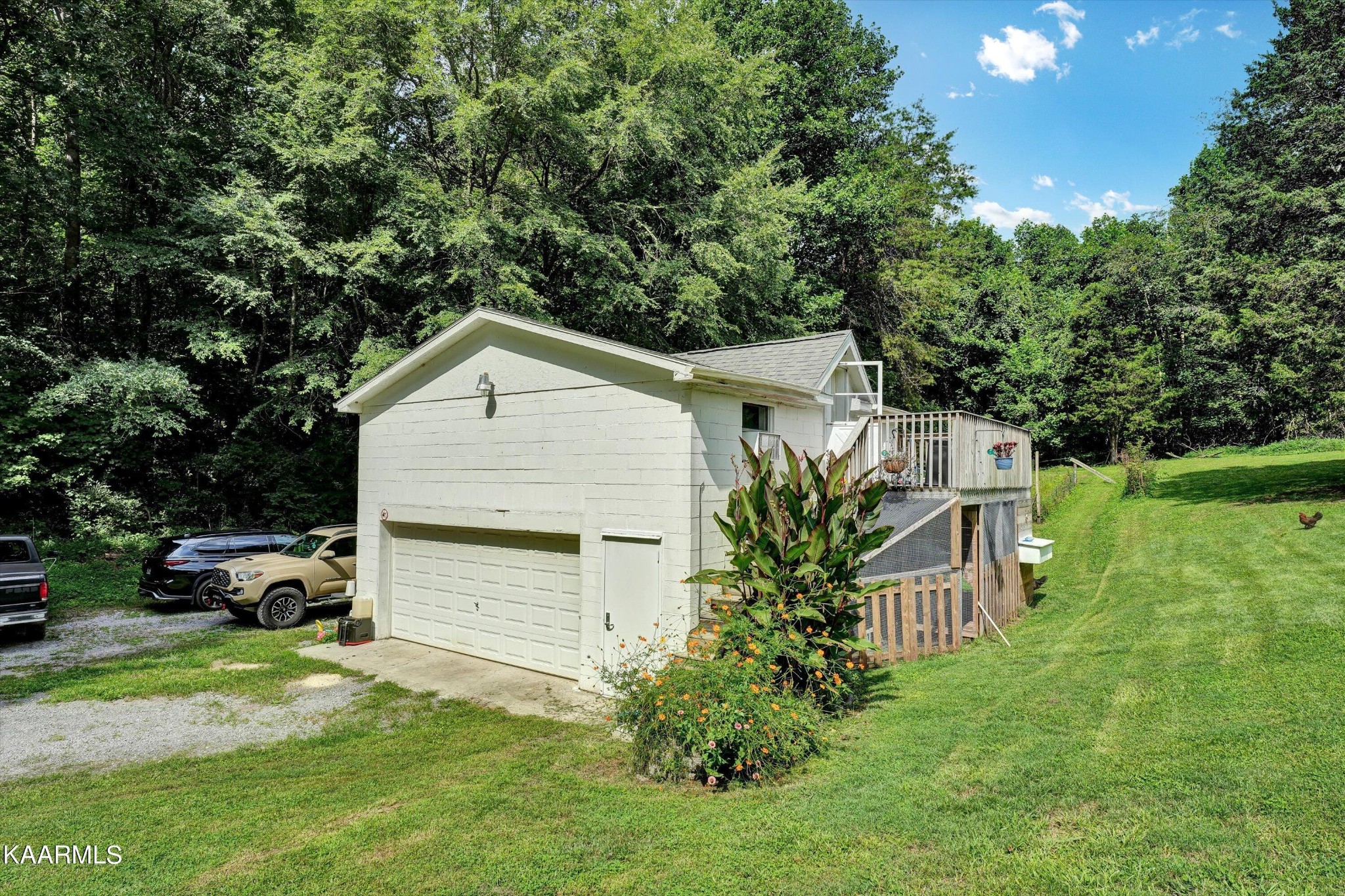 185 Moody Hollow Road Powell, TN 37849 - Photo 21 of 46 a front view of a house with a yard and garage