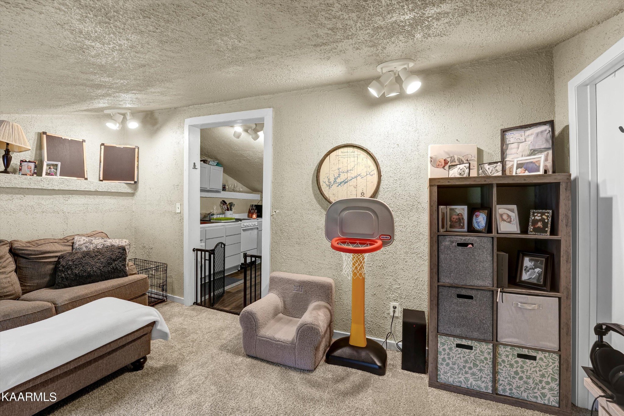 185 Moody Hollow Road Powell, TN 37849 - Photo 23 of 46 a living room with furniture a rug and a wall painting