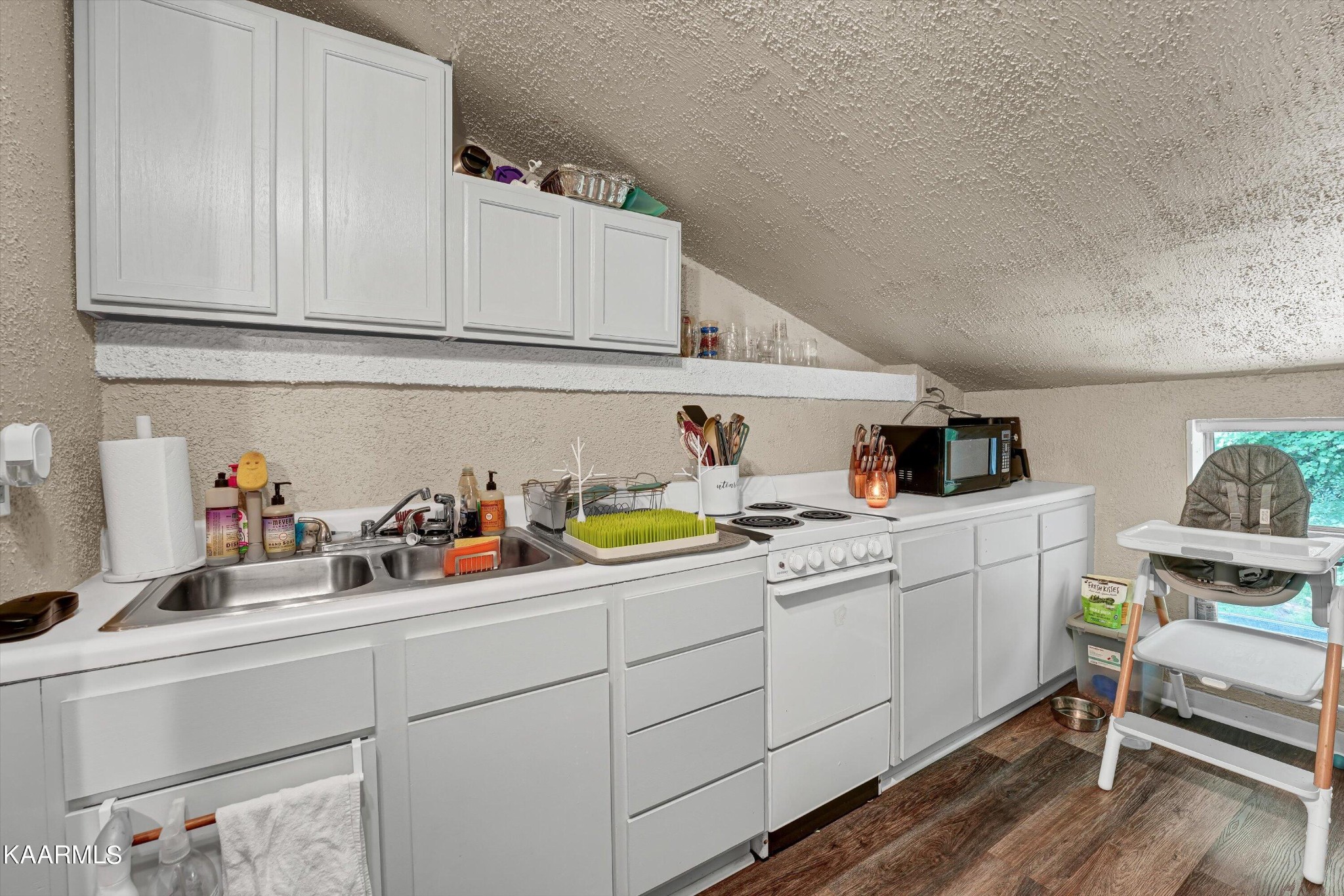 185 Moody Hollow Road Powell, TN 37849 - Photo 26 of 46 a kitchen with sink cabinets and appliances
