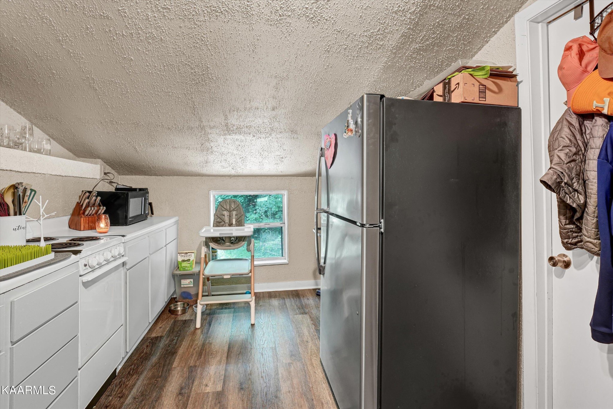 185 Moody Hollow Road Powell, TN 37849 - Photo 27 of 46 a kitchen with a refrigerator and a sink
