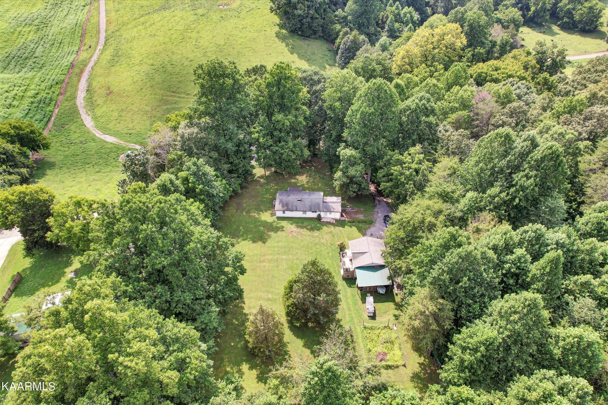 185 Moody Hollow Road Powell, TN 37849 - Photo 29 of 46 an aerial view of residential house with outdoor space and swimming pool