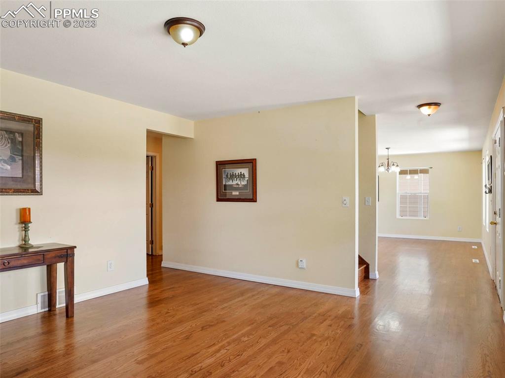 13550 Murphy Road Elbert, CO 80106 - Photo 15 of 42 a view of an empty room with wooden floor and a window