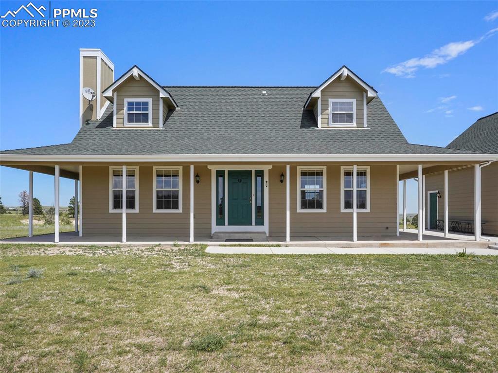 13550 Murphy Road Elbert, CO 80106 - Photo 42 of 42 a front view of a house with a yard