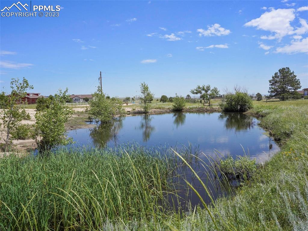 13550 Murphy Road Elbert, CO 80106 - Photo 9 of 42 a view of a lake with houses in back