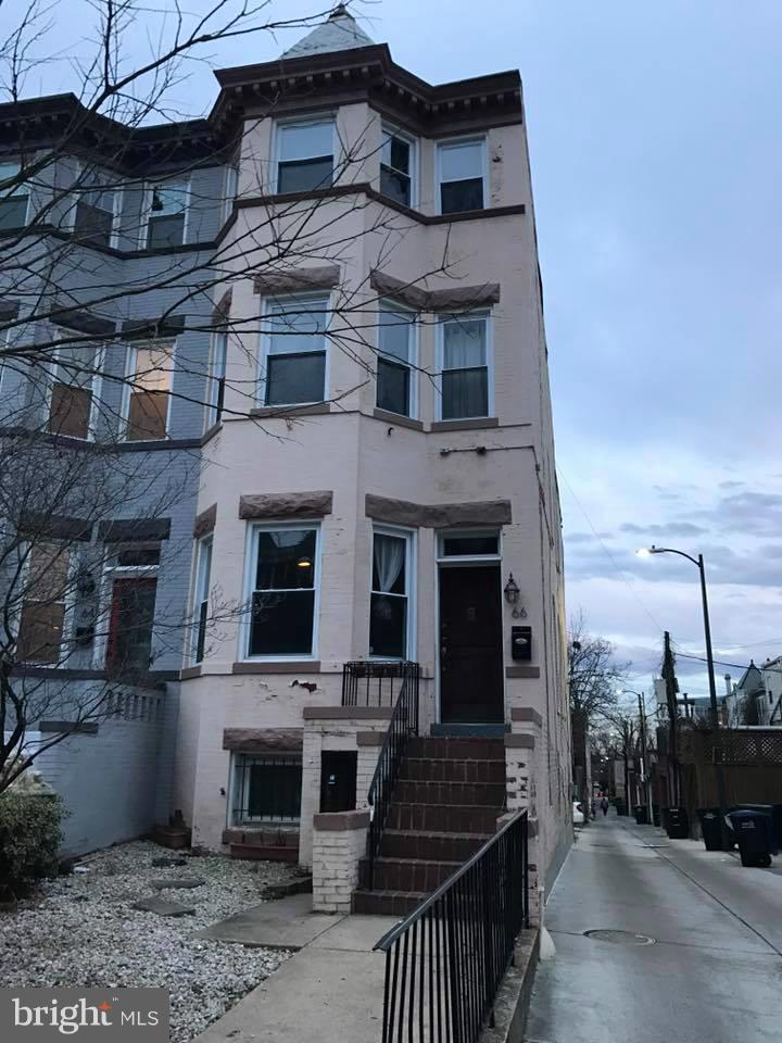 a view of a building with a yard