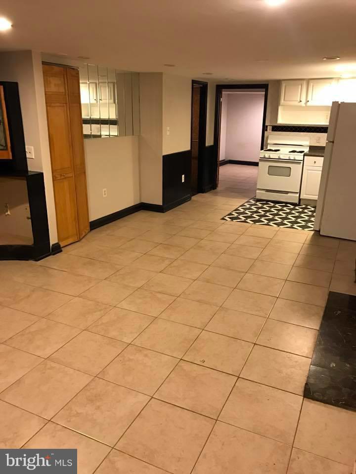 66 Bryant Street Northwest, Unit B Washington, DC 20001 - Photo 2 of 11 a living room with a couch