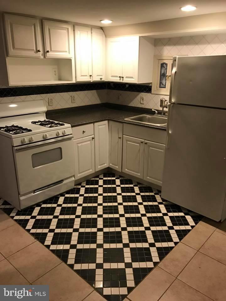 66 Bryant Street Northwest, Unit B Washington, DC 20001 - Photo 5 of 11 a kitchen with a stove and a refrigerator