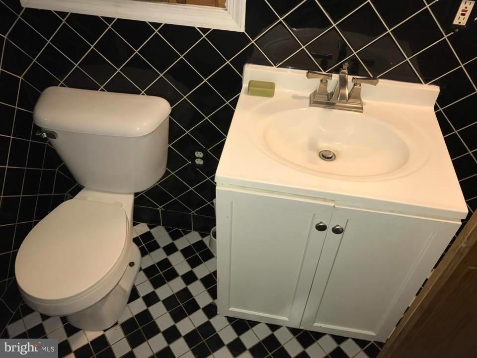 66 Bryant Street Northwest, Unit B Washington, DC 20001 - Photo 6 of 11 a bathroom with a sink toilet and shower