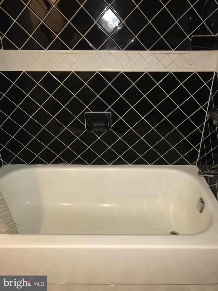 66 Bryant Street Northwest, Unit B Washington, DC 20001 - Photo 7 of 11 a bathroom with a black wall