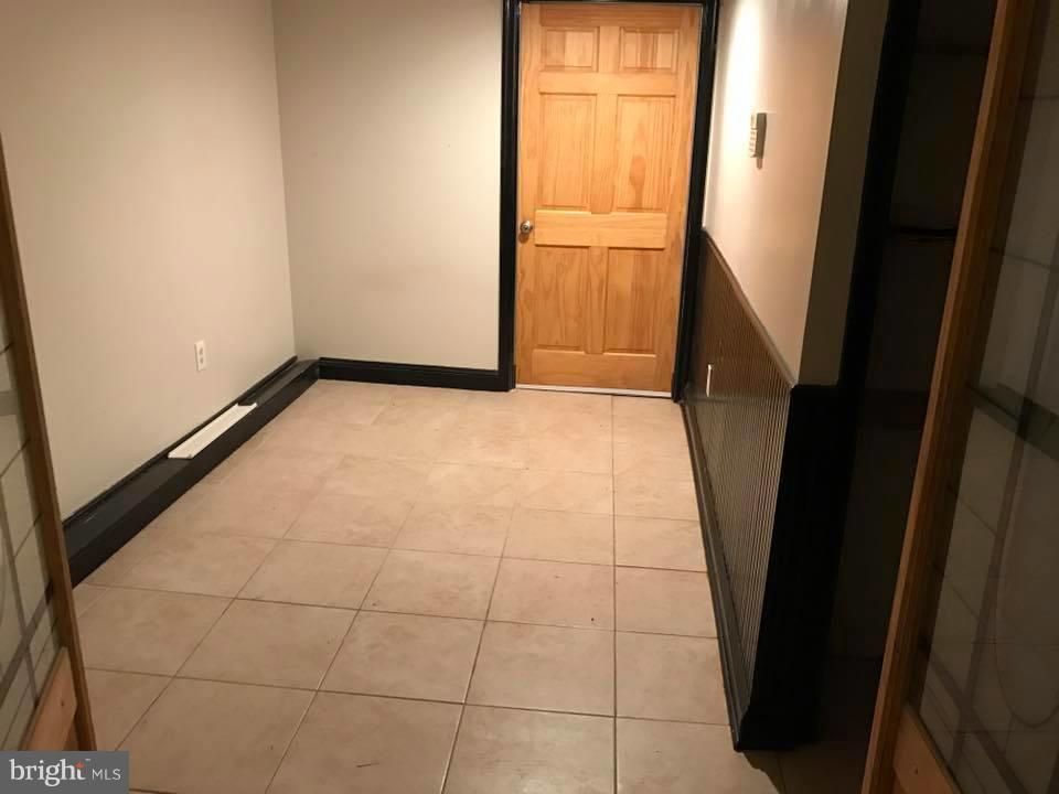 66 Bryant Street Northwest, Unit B Washington, DC 20001 - Photo 10 of 11 a view of an empty room and a window