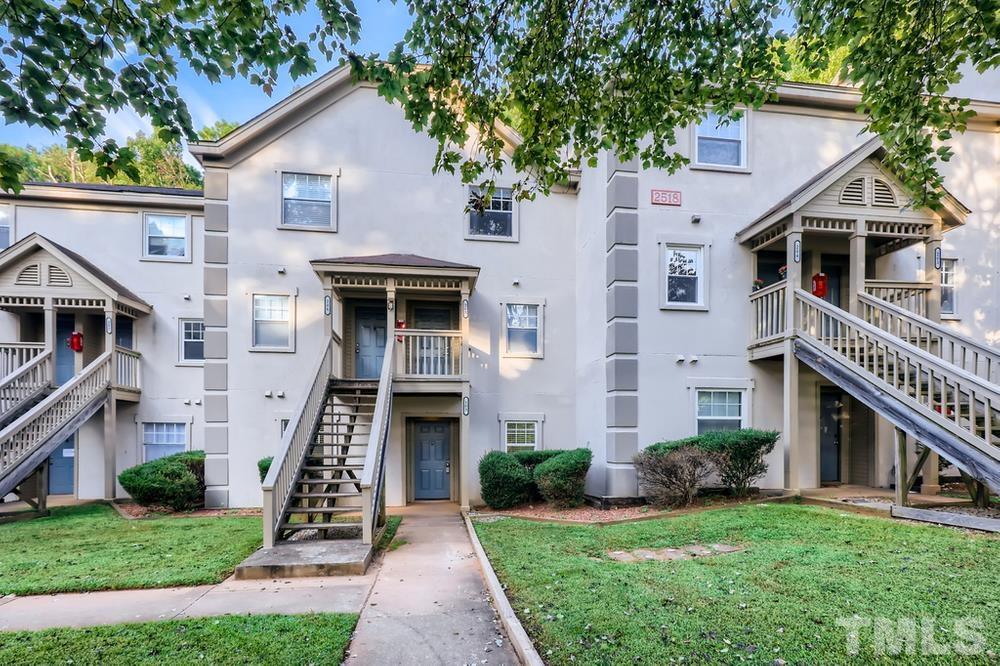 2518 Avent Ferry Road, Unit 103 Raleigh, NC 27606 - Photo 1 of 28 a front view of house with yard and green space