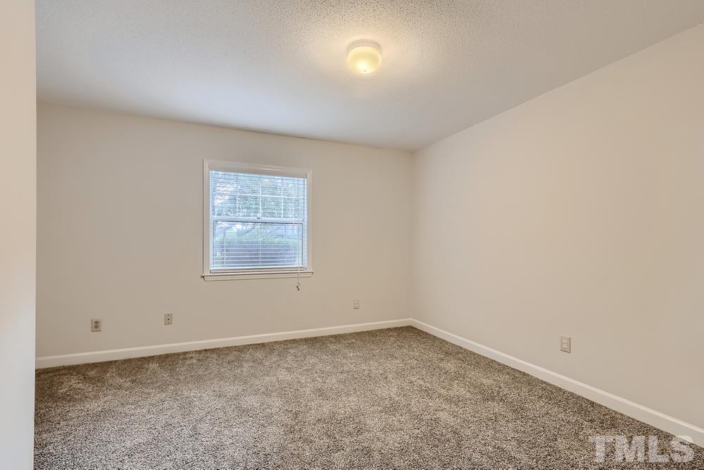 2518 Avent Ferry Road, Unit 103 Raleigh, NC 27606 - Photo 15 of 28 an empty room with a window