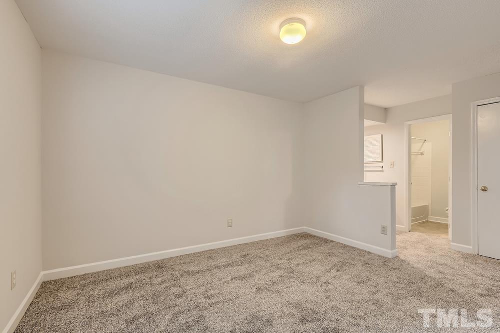 2518 Avent Ferry Road, Unit 103 Raleigh, NC 27606 - Photo 16 of 28 an empty room with a natural light