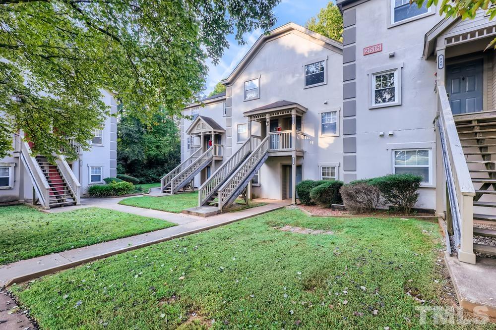 2518 Avent Ferry Road, Unit 103 Raleigh, NC 27606 - Photo 3 of 28 a front view of a house with a yard
