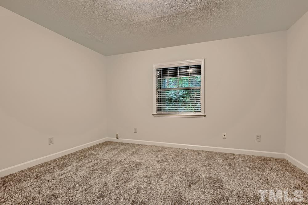 2518 Avent Ferry Road, Unit 103 Raleigh, NC 27606 - Photo 21 of 28 an empty room with a window