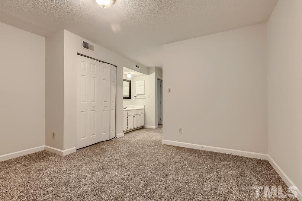 2518 Avent Ferry Road, Unit 103 Raleigh, NC 27606 - Photo 22 of 28 an empty room with a bathroom