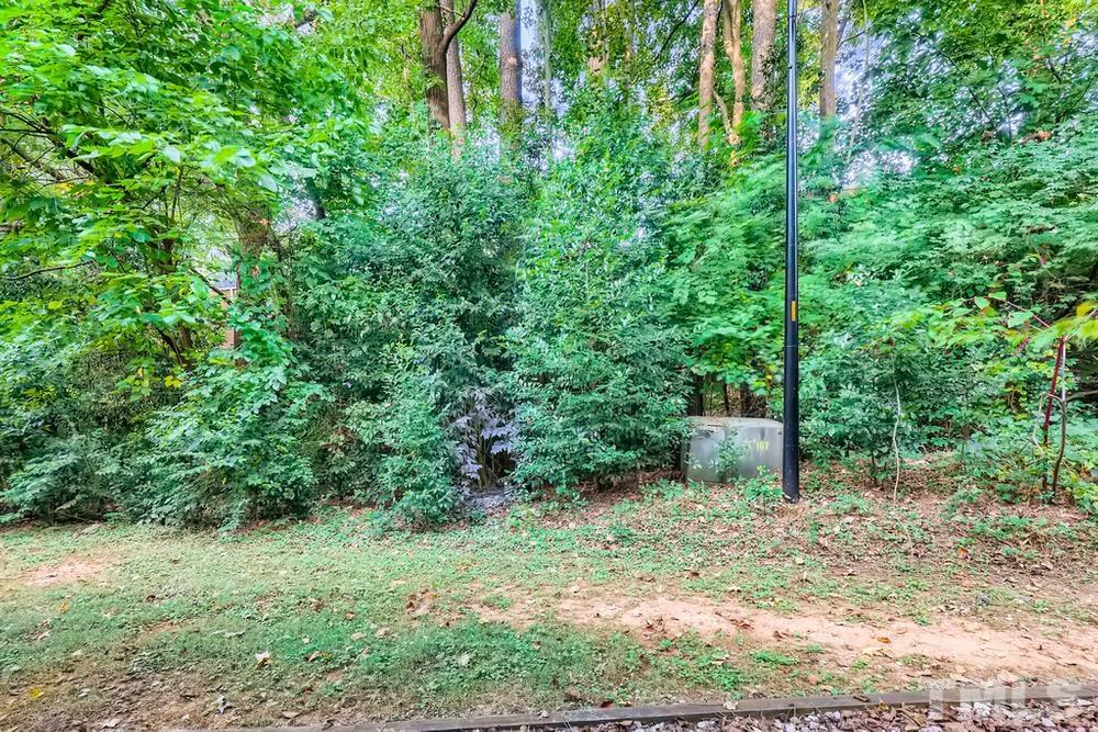 2518 Avent Ferry Road, Unit 103 Raleigh, NC 27606 - Photo 24 of 28 a view of a outdoor space and trees all around