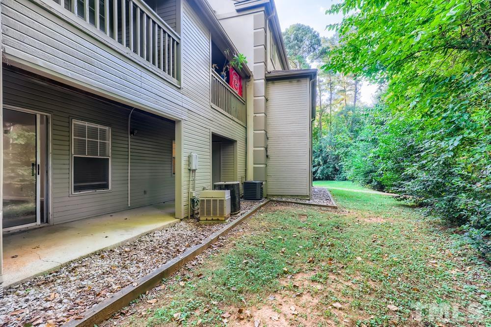 2518 Avent Ferry Road, Unit 103 Raleigh, NC 27606 - Photo 27 of 28 a front view of a house with garden