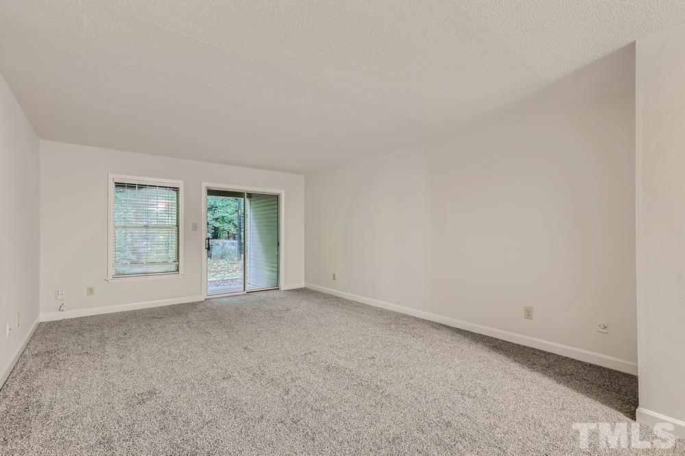2518 Avent Ferry Road, Unit 103 Raleigh, NC 27606 - Photo 5 of 28 an empty room with windows