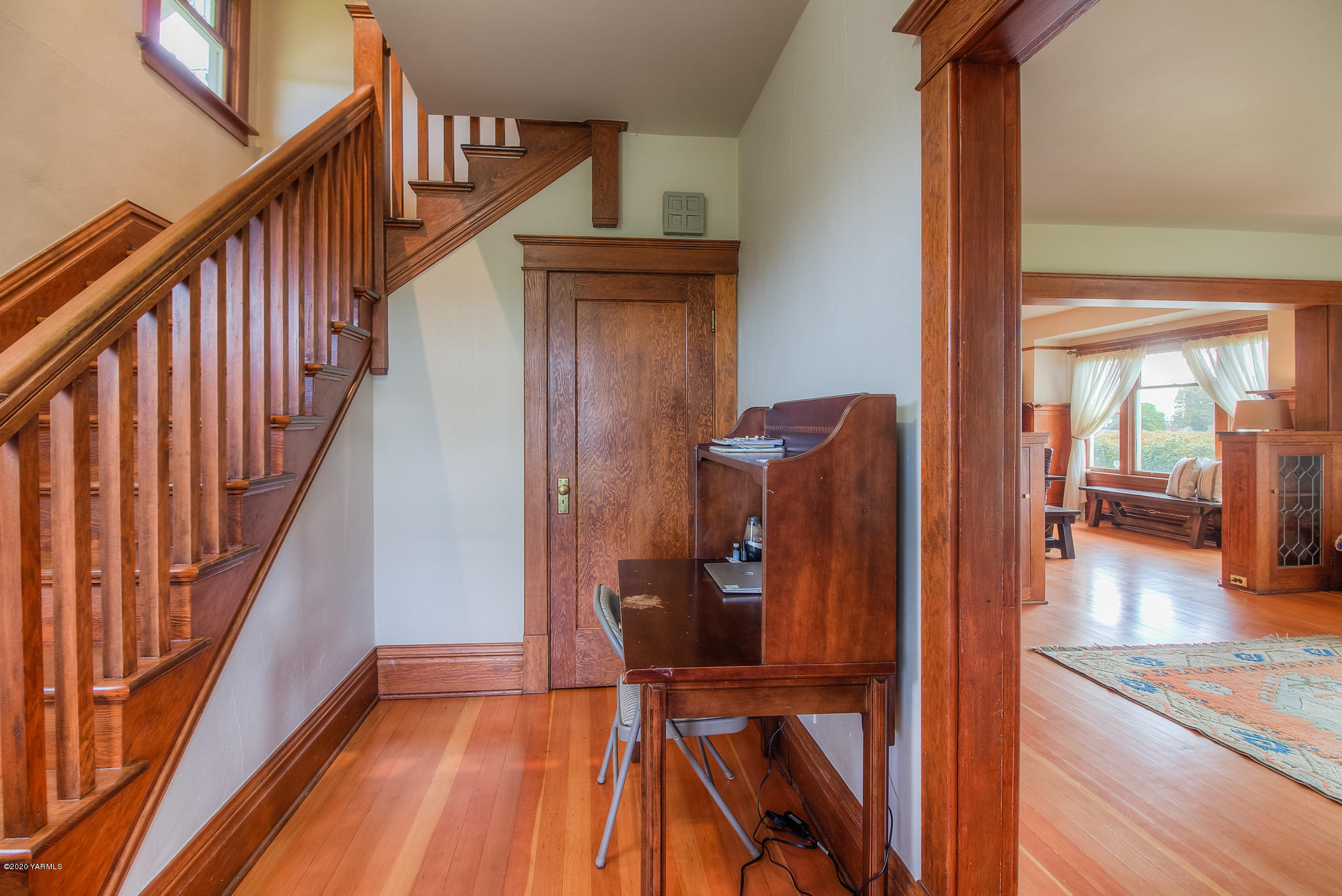 791 Becker Road Toppenish, WA 98948 - Photo 11 of 78 a view of a hallway with wooden floor and staircase