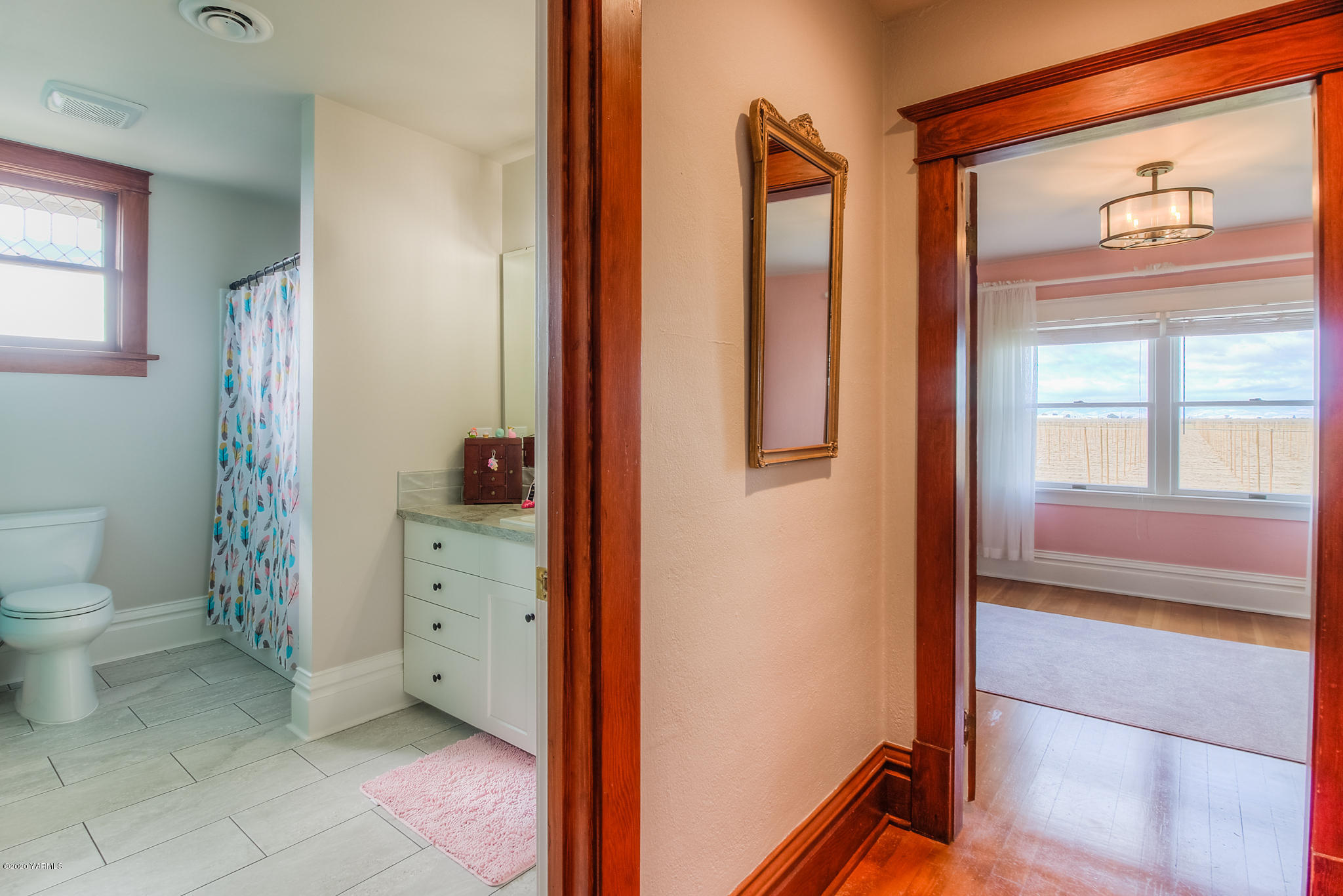 791 Becker Road Toppenish, WA 98948 - Photo 59 of 78 a bathroom with a granite countertop sink and a mirror