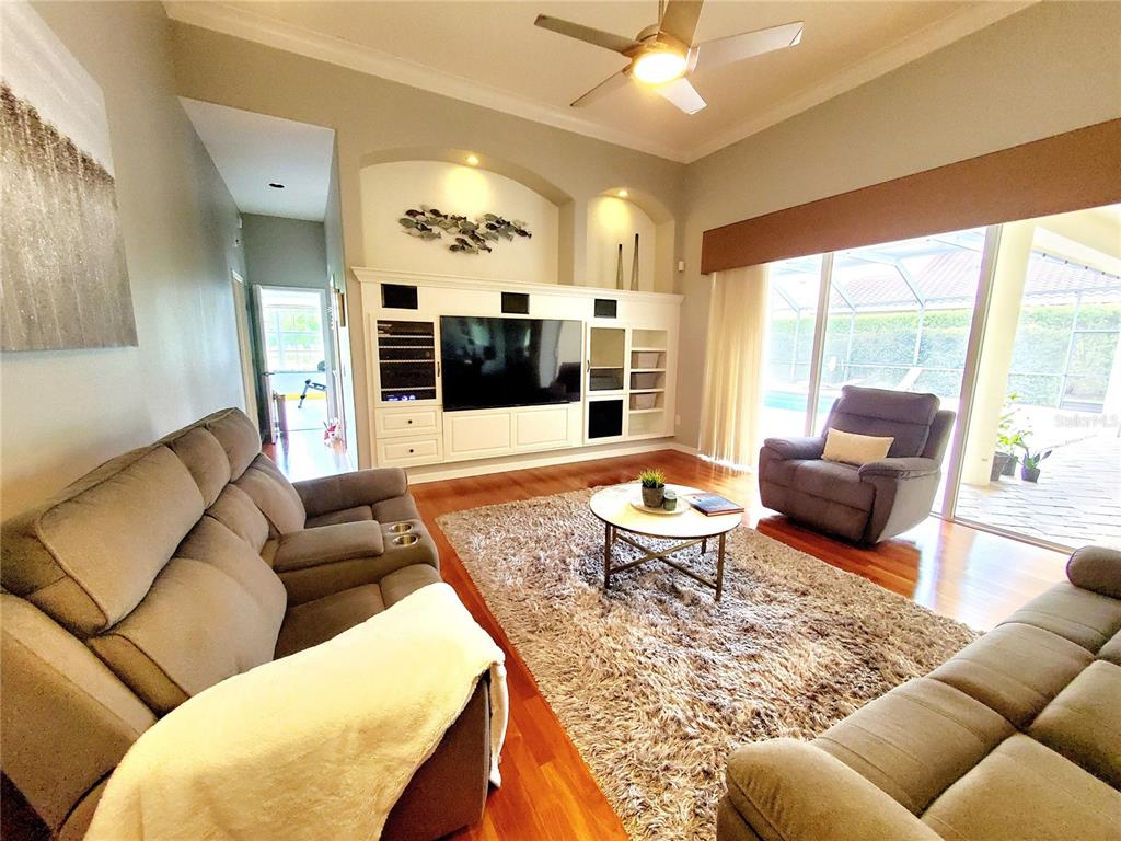 10004 Tree Tops Lake Road Tampa, FL 33626 - Photo 24 of 74 a living room with furniture and a large window