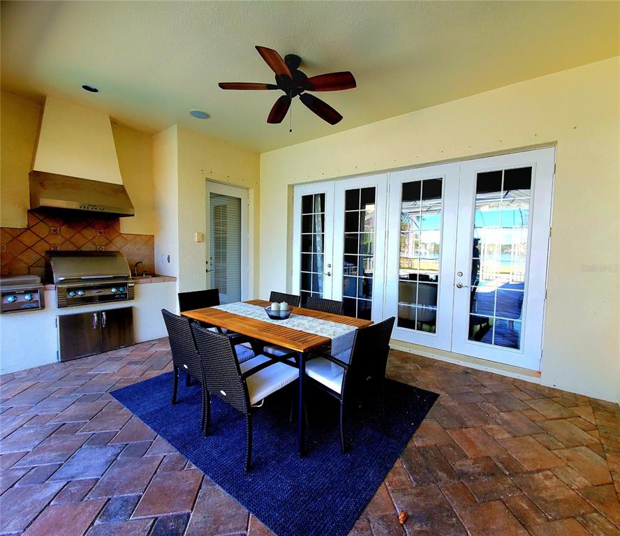 10004 Tree Tops Lake Road Tampa, FL 33626 - Photo 53 of 74 a dining room with wooden floor and breakfast area