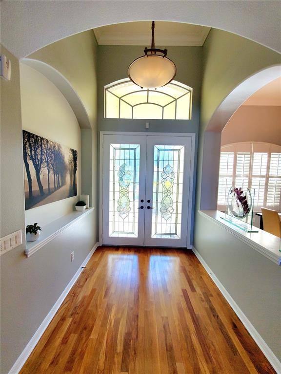 10004 Tree Tops Lake Road Tampa, FL 33626 - Photo 7 of 74 a view of empty room with wooden floor and fan