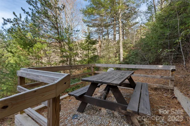 a view of a chairs and table on the deck