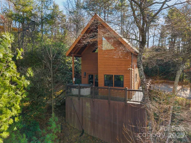 a view of house with a small yard