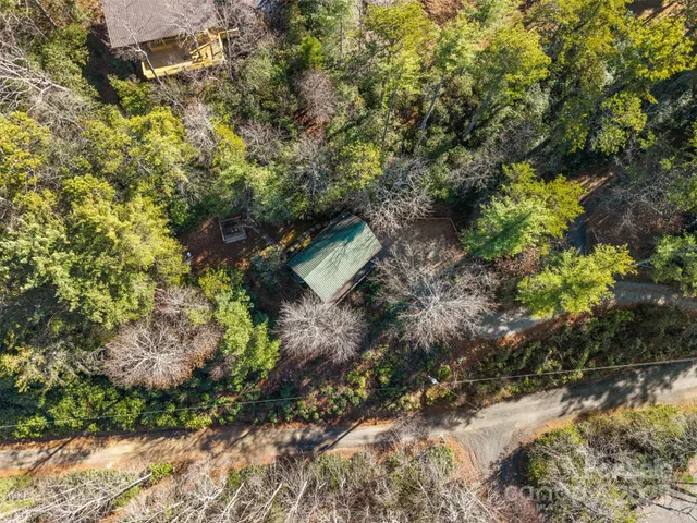 a backyard of a house with a yard with outdoor seating