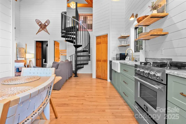 a kitchen with stainless steel appliances granite countertop a stove and a sink