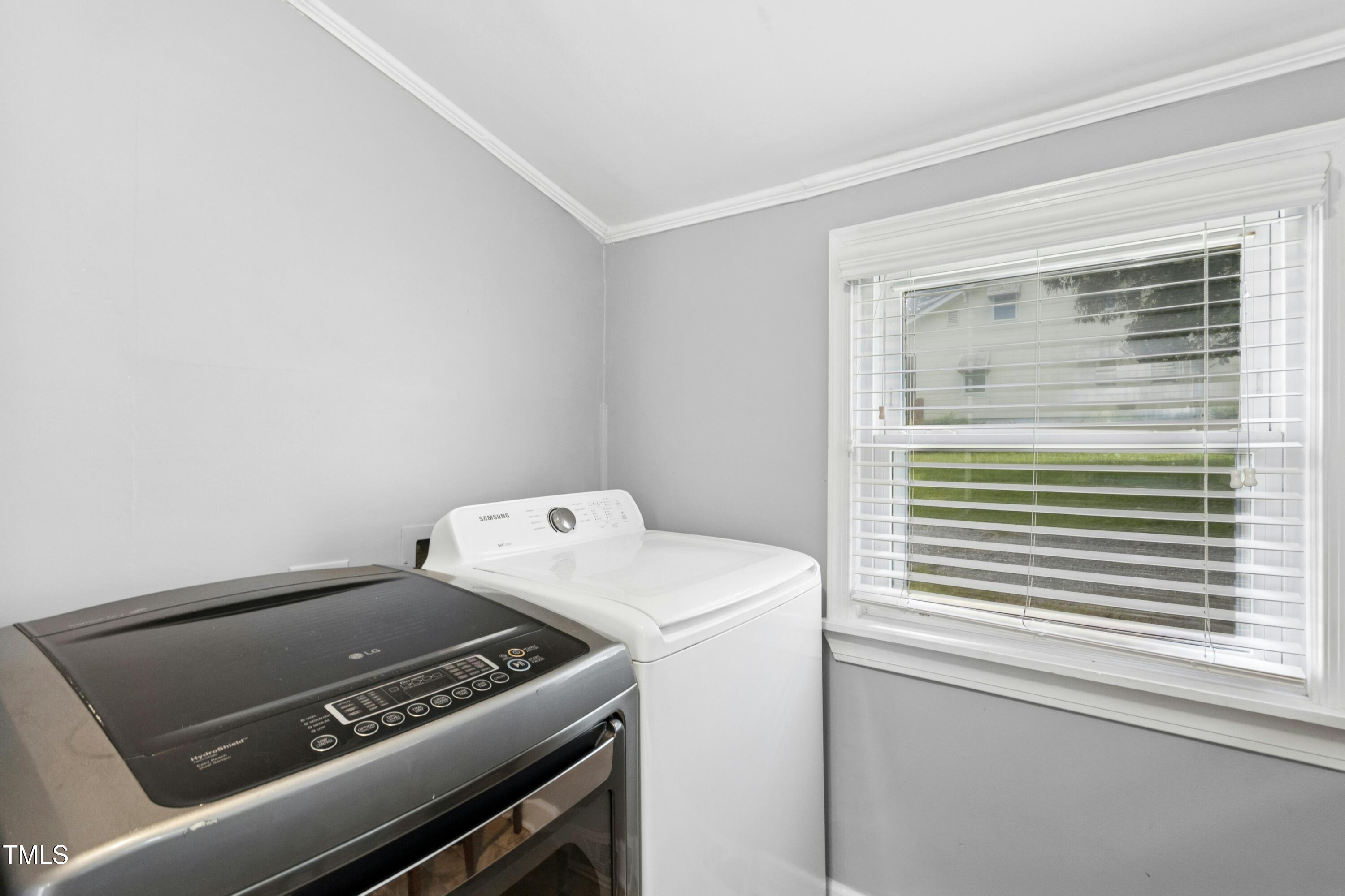 302 North 13th Street Erwin, NC 28339 - Photo 18 of 21 a view of storage and utility room with washer and dryer