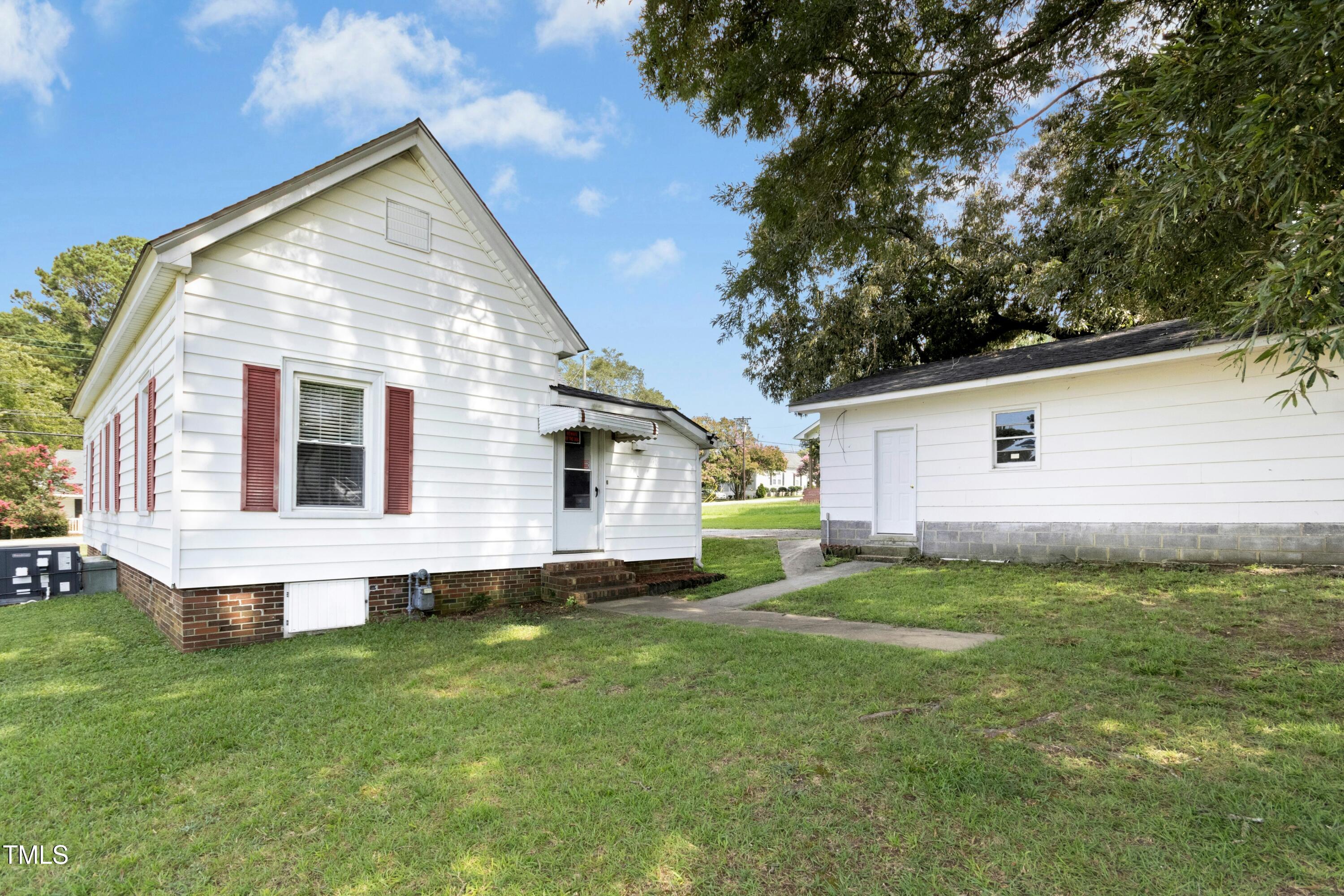 302 North 13th Street Erwin, NC 28339 - Photo 20 of 21 a view of a backyard with a garden