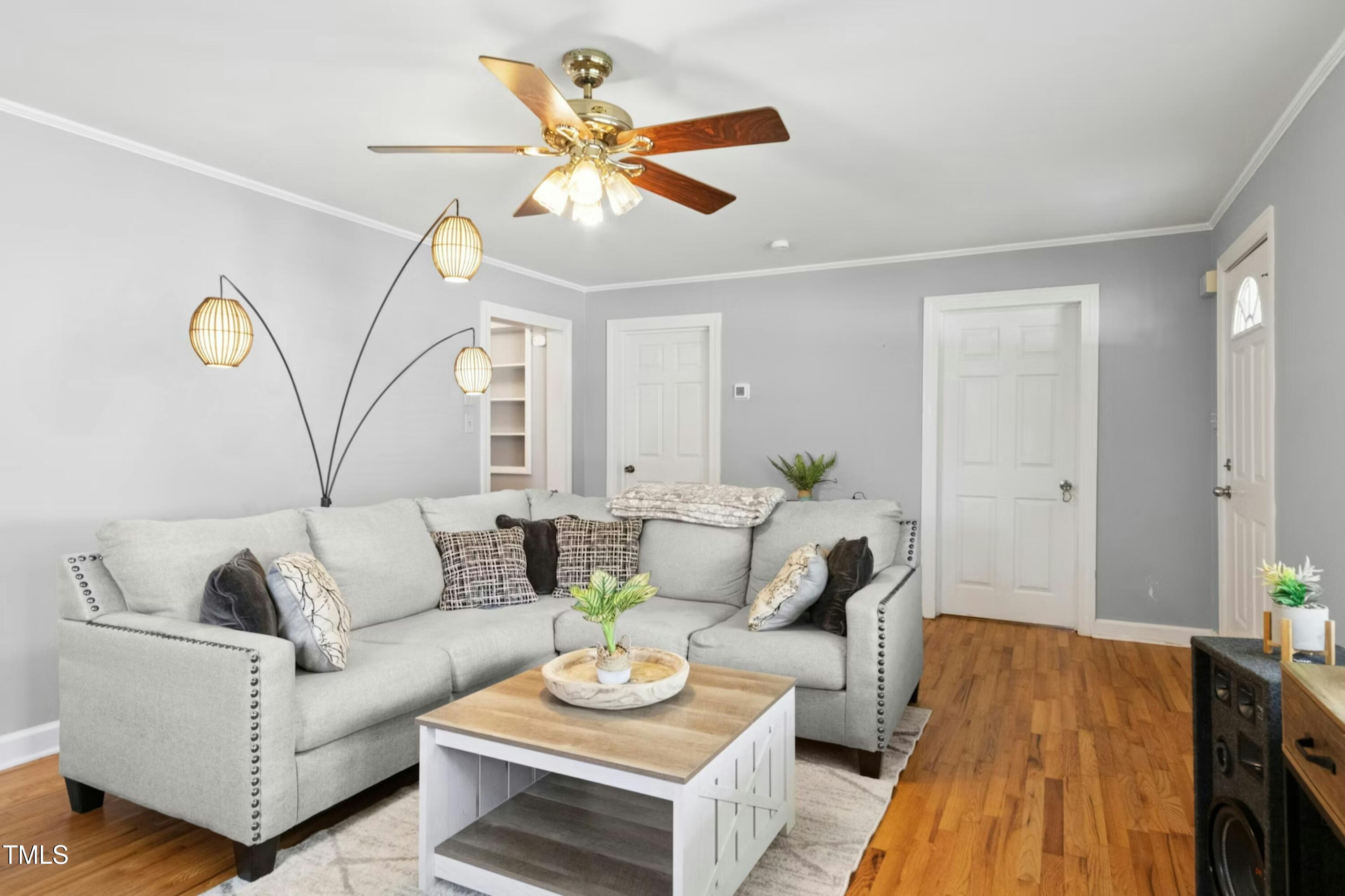 302 North 13th Street Erwin, NC 28339 - Photo 4 of 21 a living room with furniture and a wooden floor
