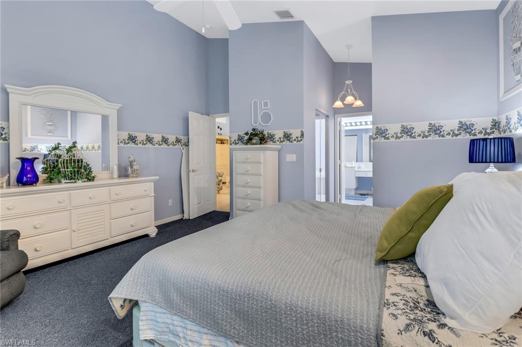 9054 Springview Loop Estero, FL 33928 - Photo 12 of 24 a bedroom with a bed and a dresser