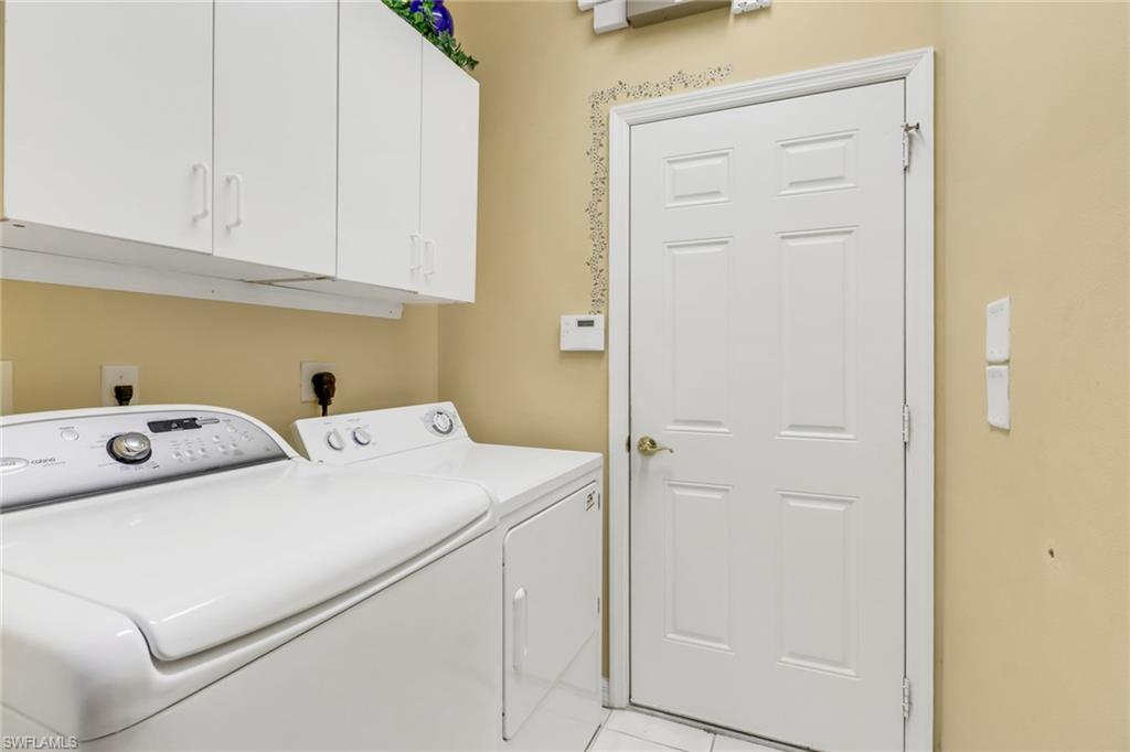 9054 Springview Loop Estero, FL 33928 - Photo 20 of 24 a utility room with dryer and washer