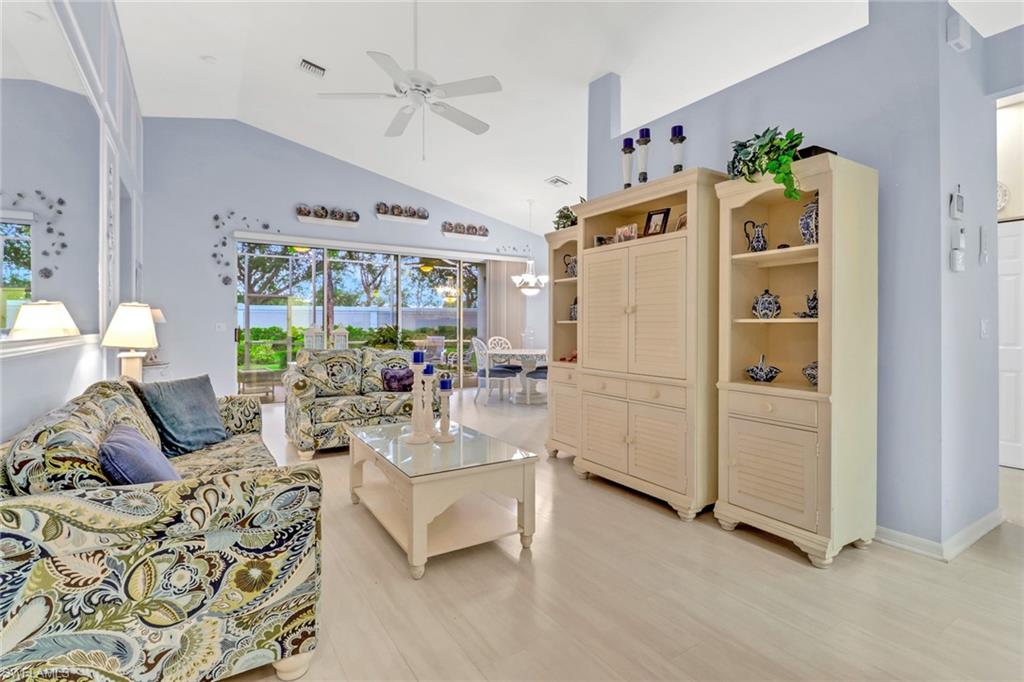 9054 Springview Loop Estero, FL 33928 - Photo 2 of 24 a living room with furniture and a large window