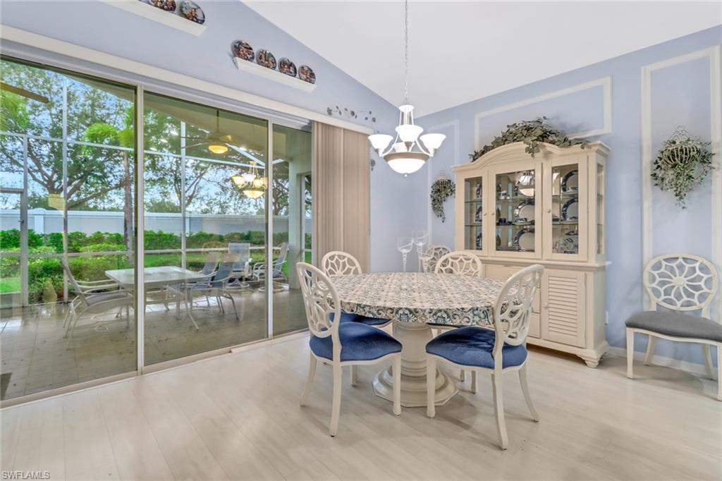 9054 Springview Loop Estero, FL 33928 - Photo 5 of 24 a dining room with furniture a rug and a large window