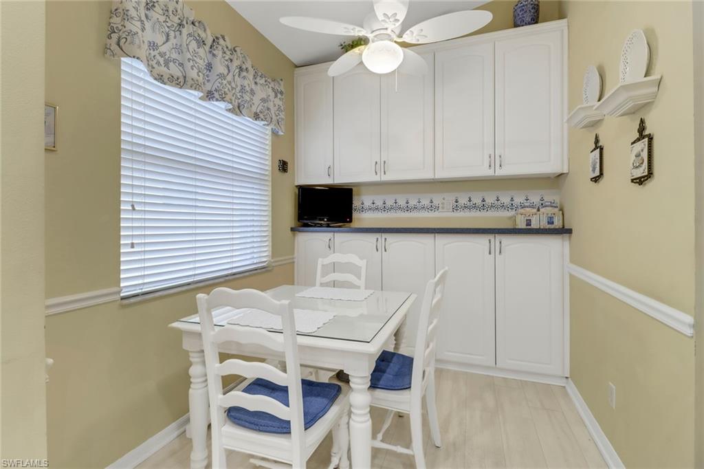 9054 Springview Loop Estero, FL 33928 - Photo 10 of 24 a kitchen with a table and chairs