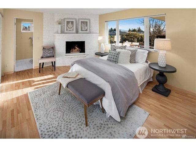 9631 Hilltop Road Bellevue, WA 98004 - Photo 11 of 17 a living room with furniture and a fireplace