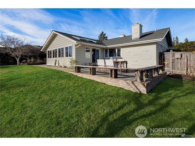 9631 Hilltop Road Bellevue, WA 98004 - Photo 12 of 17 a view of a house with a yard and sitting area