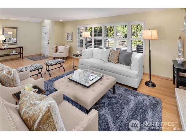 9631 Hilltop Road Bellevue, WA 98004 - Photo 5 of 17 a living room with furniture and a large window