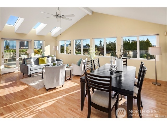 9631 Hilltop Road Bellevue, WA 98004 - Photo 7 of 17 a view of a dining room with furniture wooden floor and chandelier