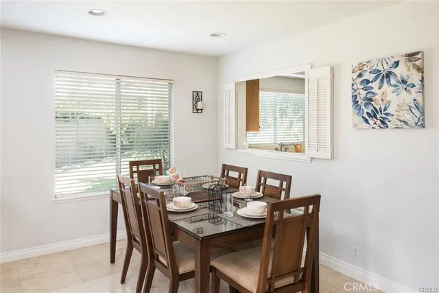 a view of a dining room with furniture window and outside view