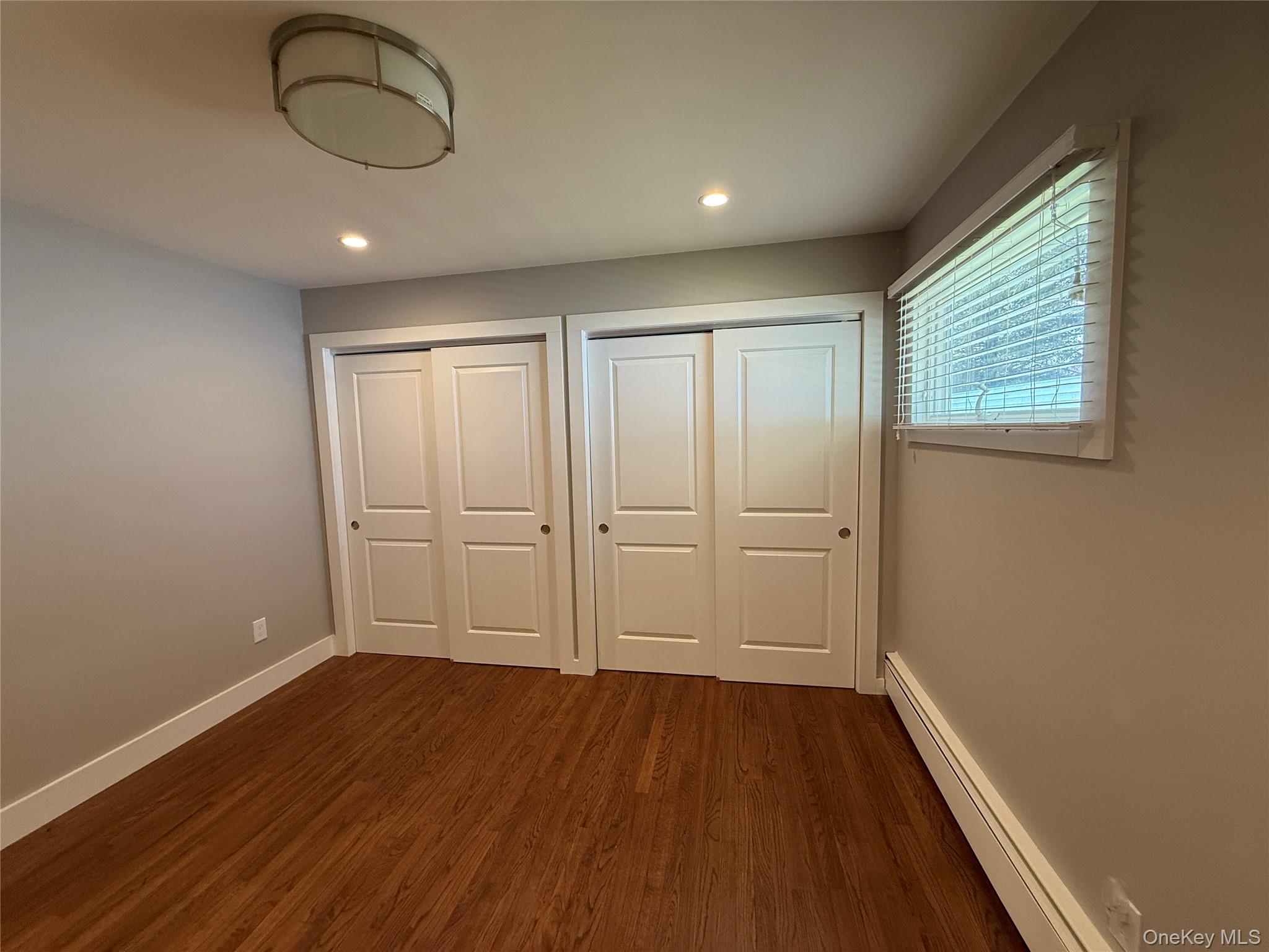 55075 Main Road, Unit YOUNGS BLDG #3 Southold, NY 11971 - Photo 5 of 16 a view of a room with wooden floor and fan