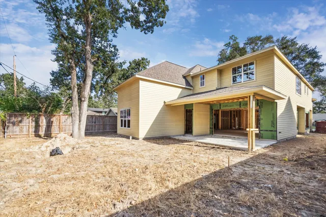a view of a house with a snow in the yard