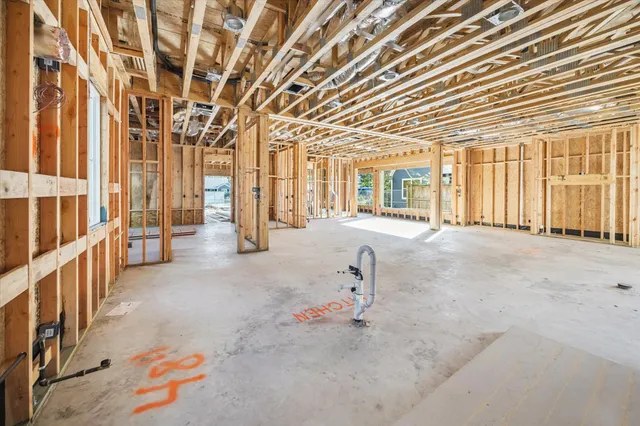 wooden floor in a room next to a window