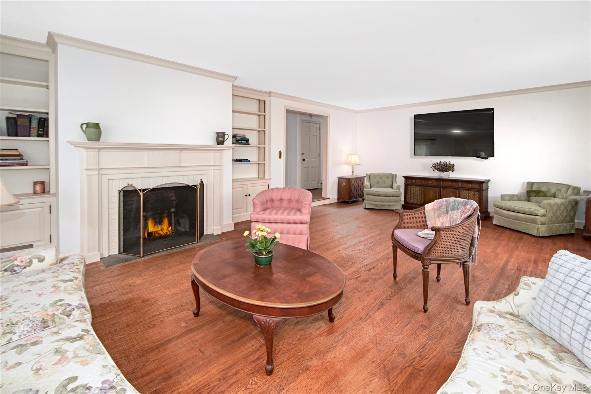71 Commodore Road Chappaqua, NY 10514 - Photo 11 of 39 a living room with furniture a flat screen tv and kitchen view